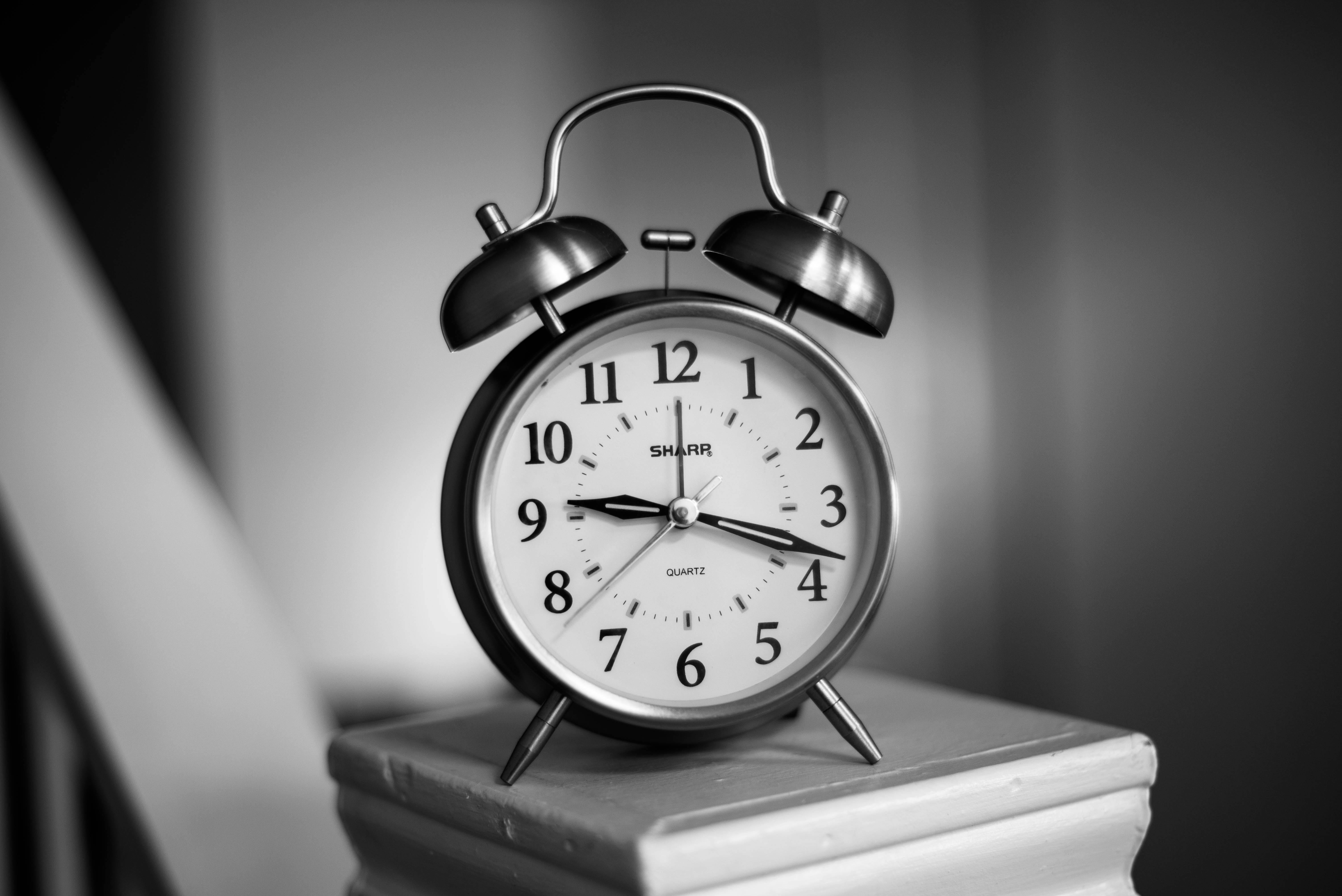 Grayscale Photo of Twin Bell Alarm Clock · Free Stock Photo