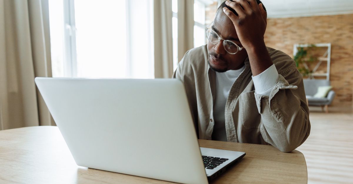 Man Using Laptop Looking Problematic · Free Stock Photo