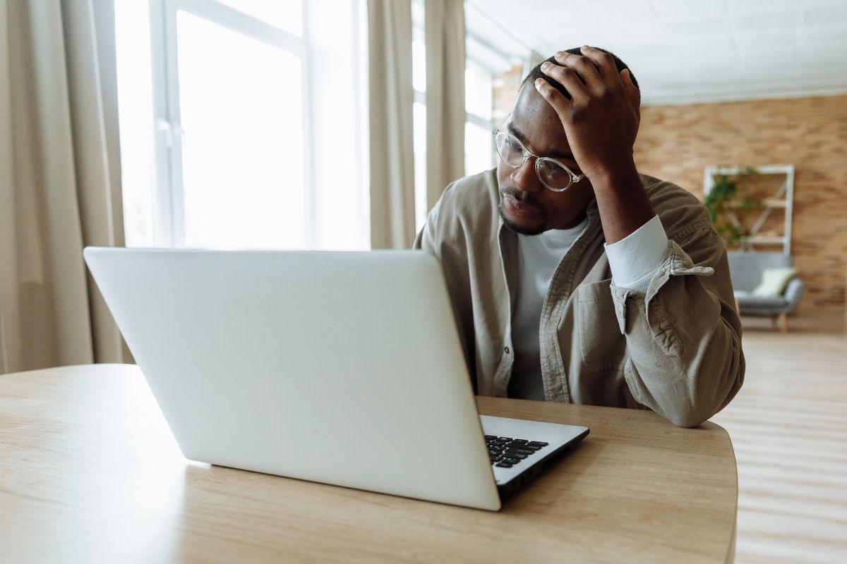 Business owner reviewing website usability and customer experience issues