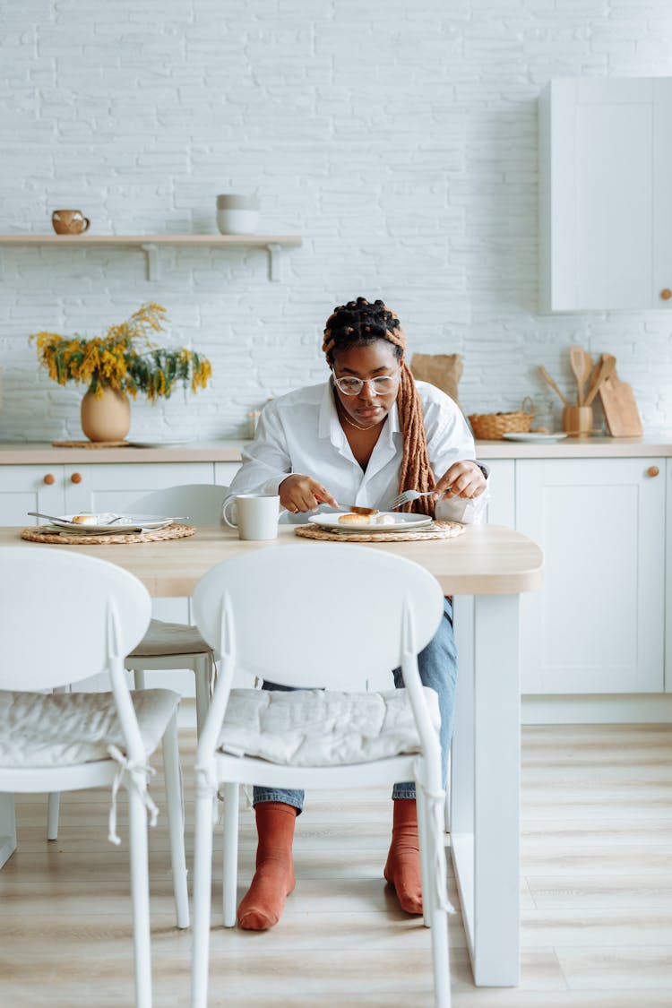 A Sad Woman Eating Breakfast