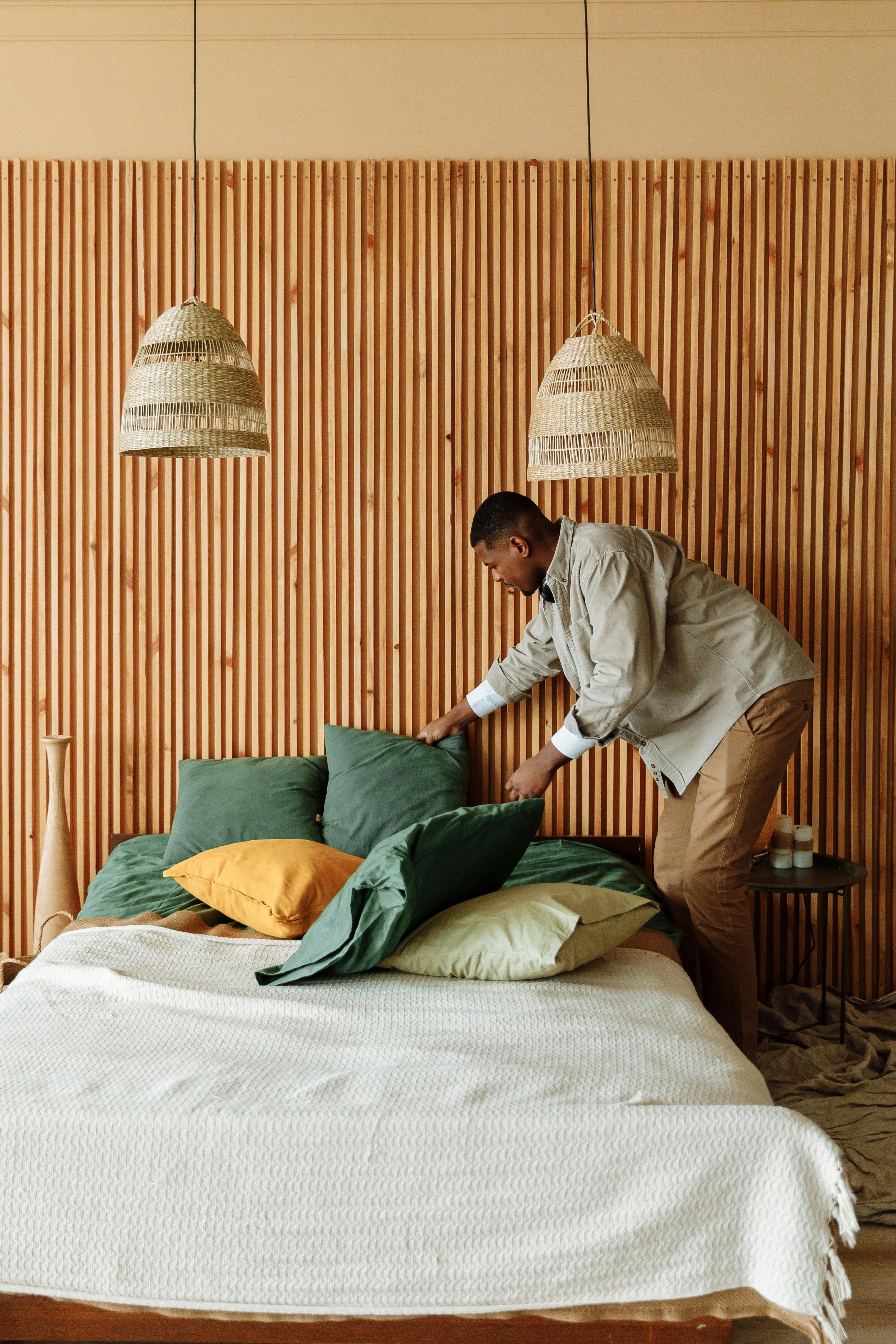 Free A Man Fixing a Bed  Stock Photo