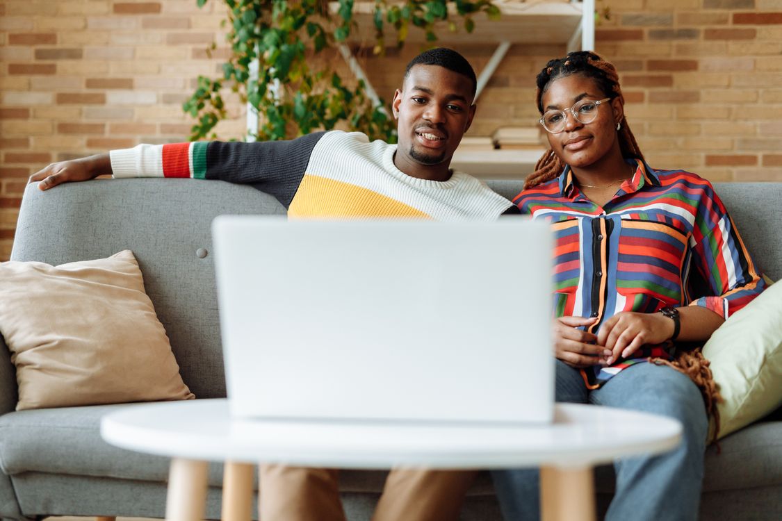 Photo of a Man and a Woman Watching on a Laptop Together · Free Stock Photo