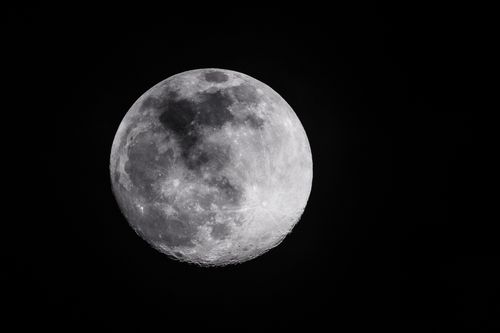 Free A stunning close-up photograph of the full moon against a dark night sky. Stock Photo