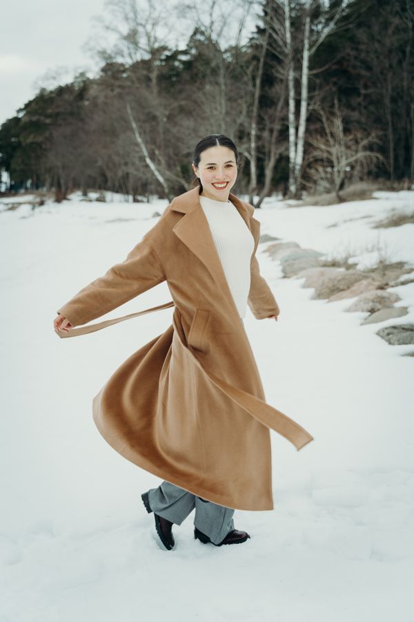 Belted chunky cardigan worn as a dress