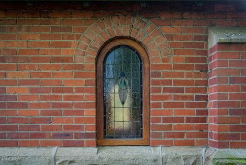 Free Wooden Window on a Brick Wall Stock Photo