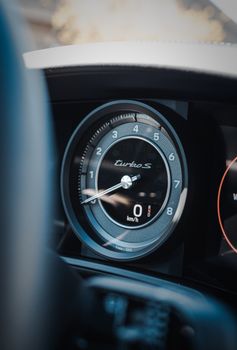 Detailed view of a Turbo S speedometer displaying speed in a high-performance car.
