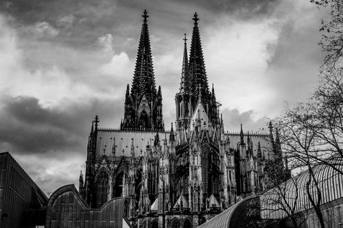 Free Black and white photograph of Cologne Cathedral's Gothic facade, showcasing intricate architecture. Stock Photo