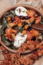Delicious salad with tomatoes and poached eggs