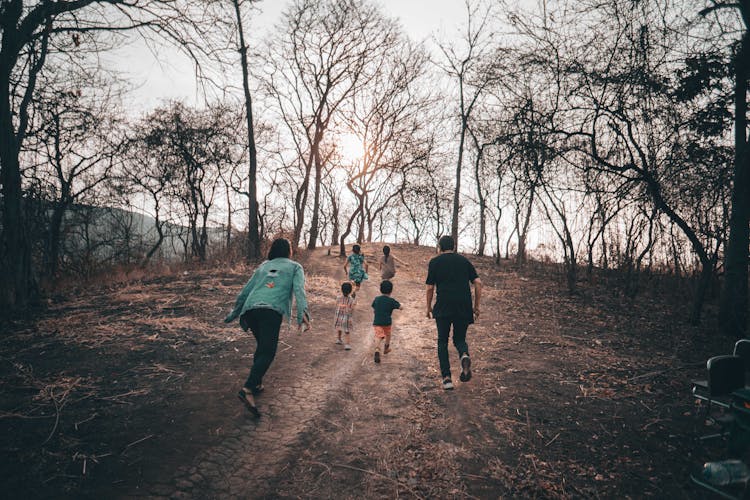 People Running In The Woods