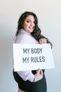 Woman Holding a Sign While Posing