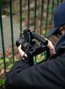 Person Holding Black Dslr Camera