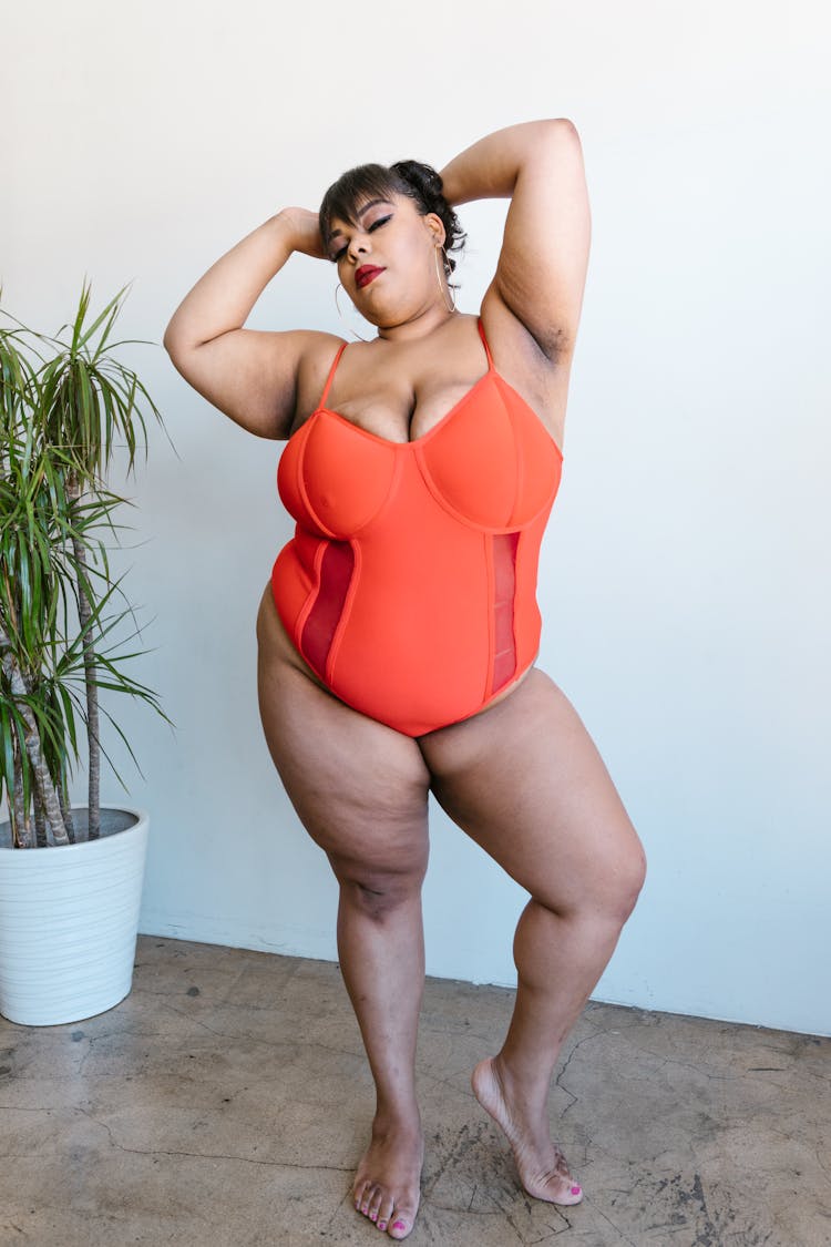 Person In Orange Swimwear Posing