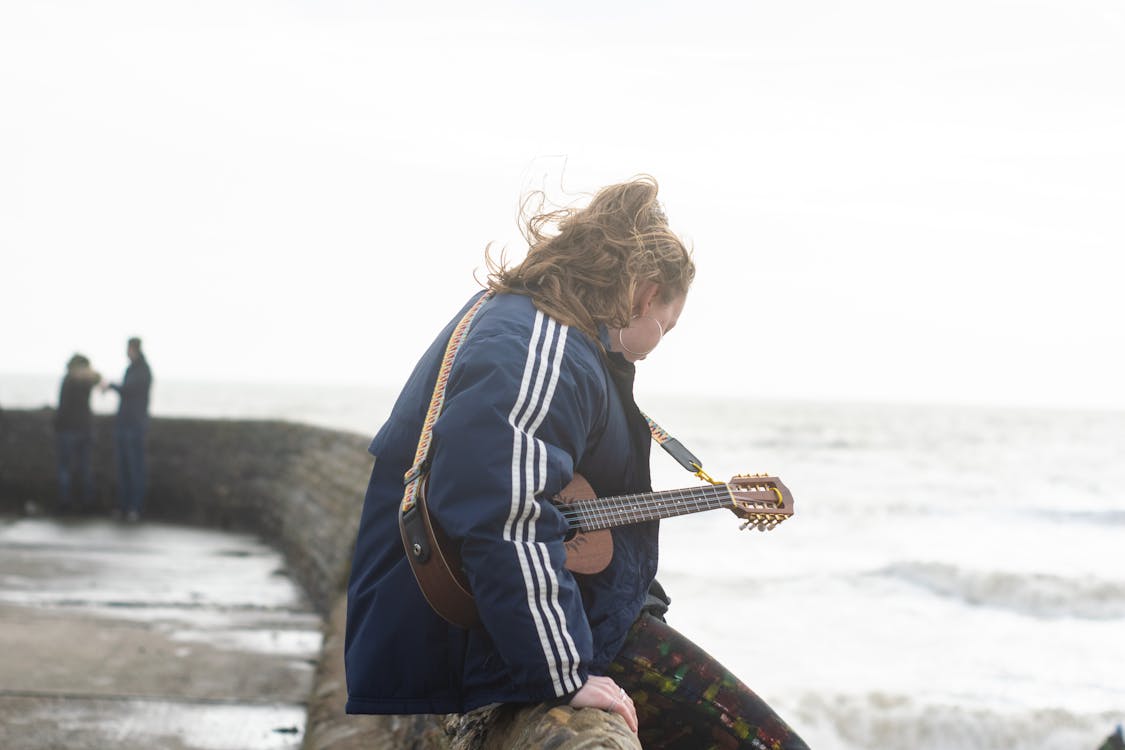 Free stock photo of beach, behind the scenes, blue jacket