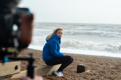 Free stock photo of beach, behind the scenes, blue jacket