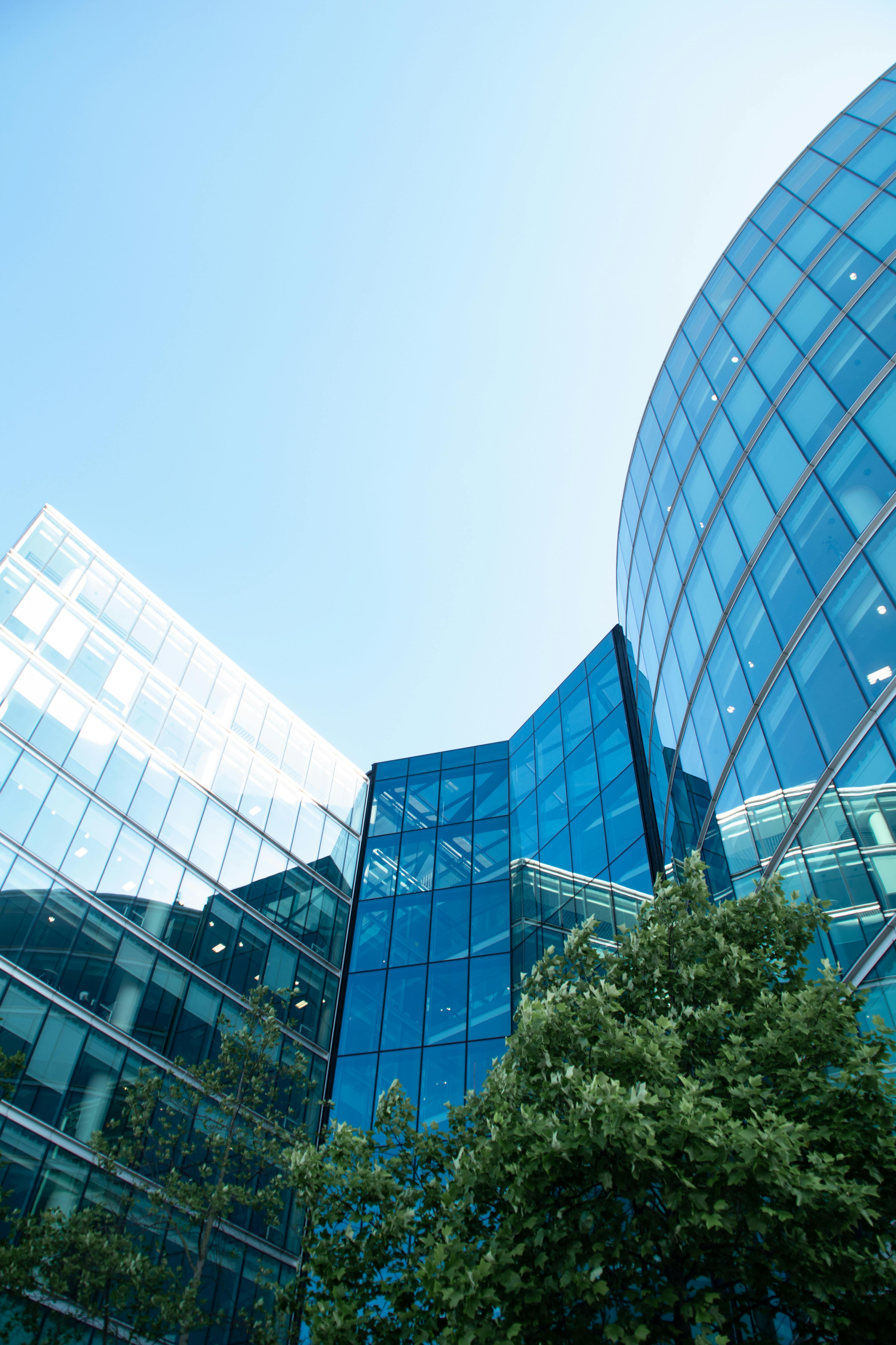 low angle shot of modern glass buildings