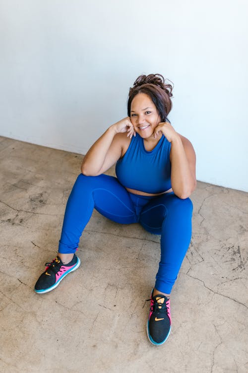 A Woman in Blue Tank Top Smiling