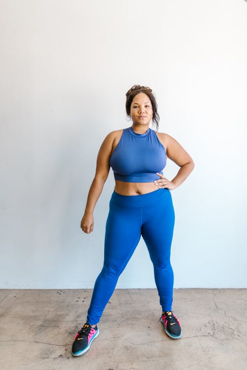 Free Woman in Blue Sports Bra and Blue Leggings Stock Photo
