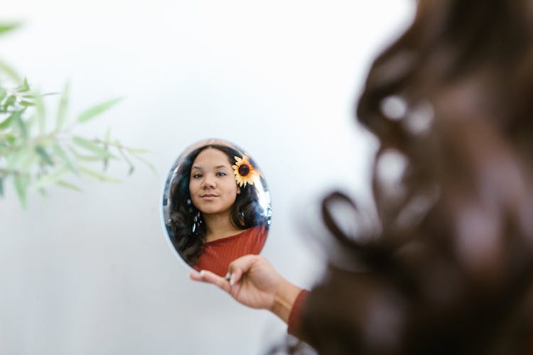 Person Holding A Mirror