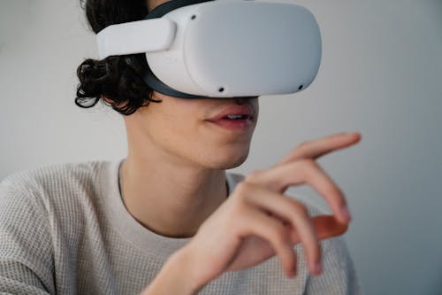 Young Hispanic guy interacting with virtual reality