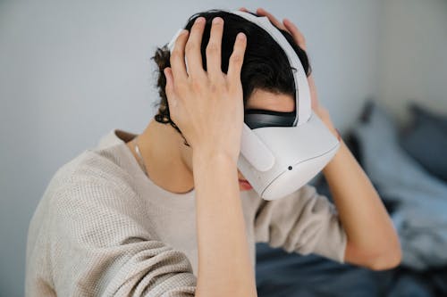 Anonymous young guy testing new VR goggles