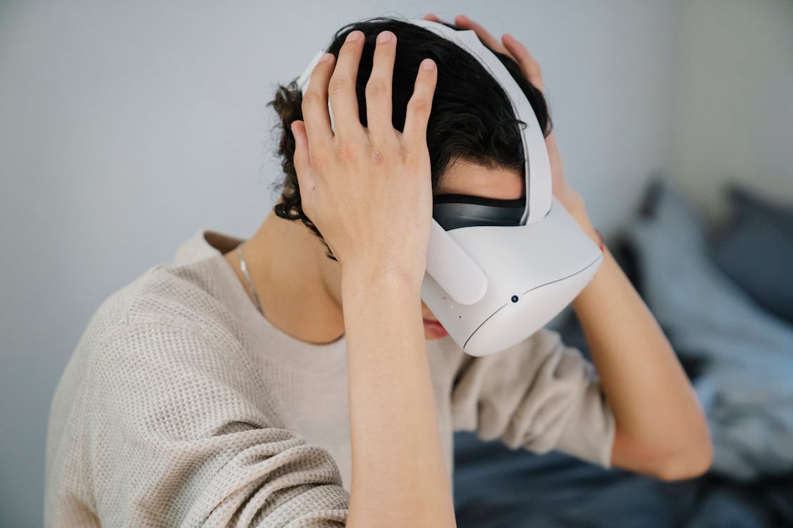 Anonymous young guy testing new VR goggles