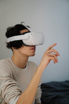 A young man interacts with a virtual reality headset, immersed in a digital world.