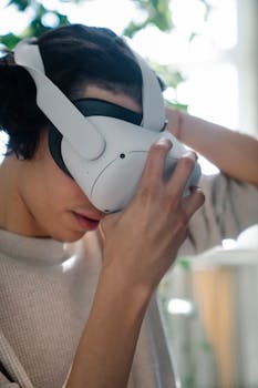 A man wearing a VR headset, immersed in a virtual reality experience indoors.