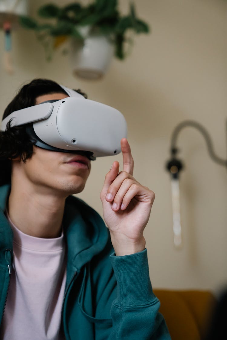 Young Man Experiencing Virtual Reality In Headset