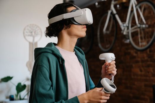 Serious man in headset for playing video game