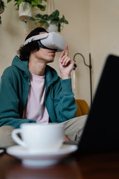 A young man using a VR headset at home, fully immersed in virtual reality.