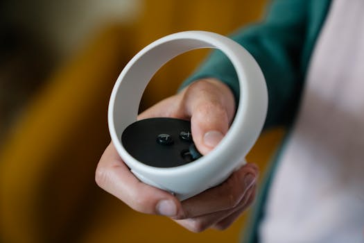 High angle of crop anonymous male gamer using VR controller for playing video game at spare time