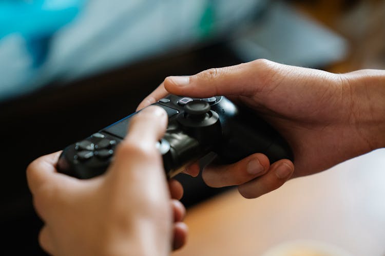 Crop Gamer With Console Controller Playing Video Game