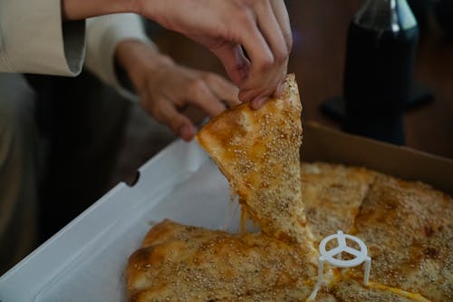 Crop person showing tasty pizza · Free Stock Photo