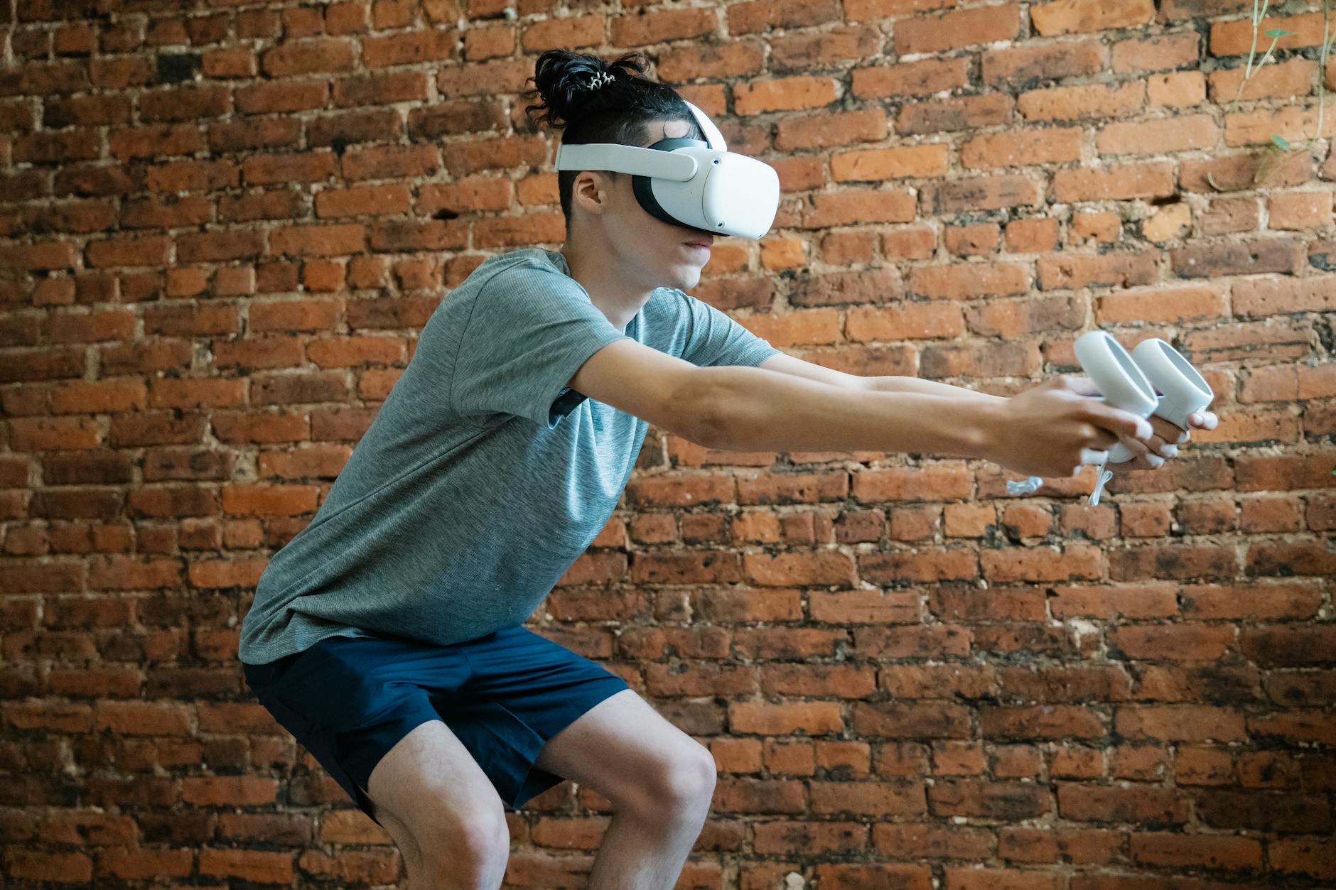 Side view of unrecognizable young male in casual clothes using virtual reality goggles