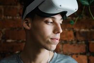 Man with VR goggles looking away