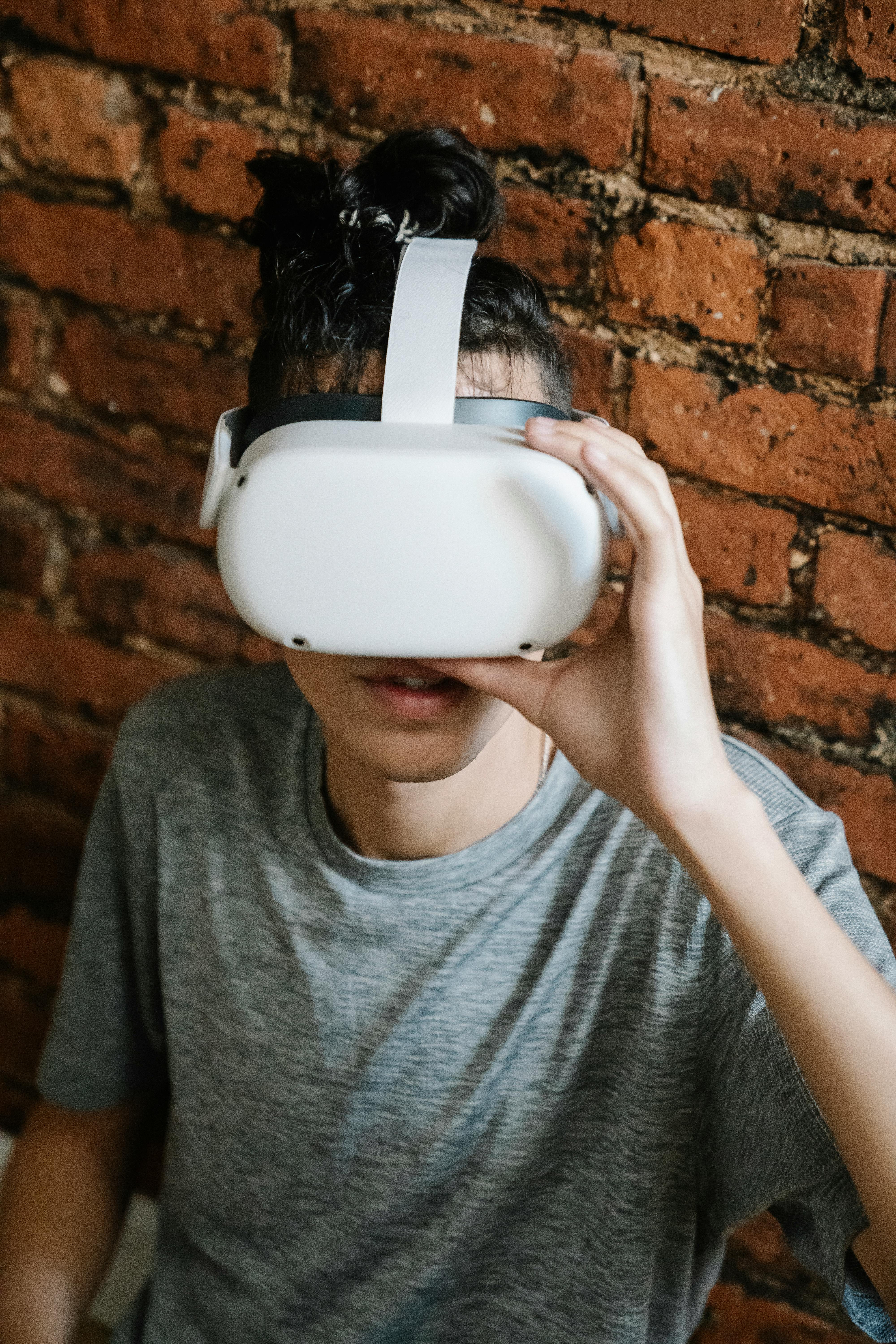 young man putting on vr headset