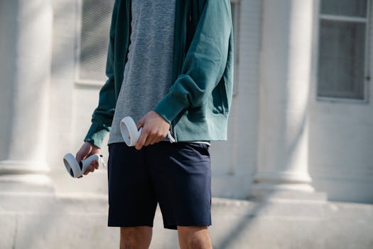 A man in outdoor activewear holding VR controllers in a sunny urban setting.