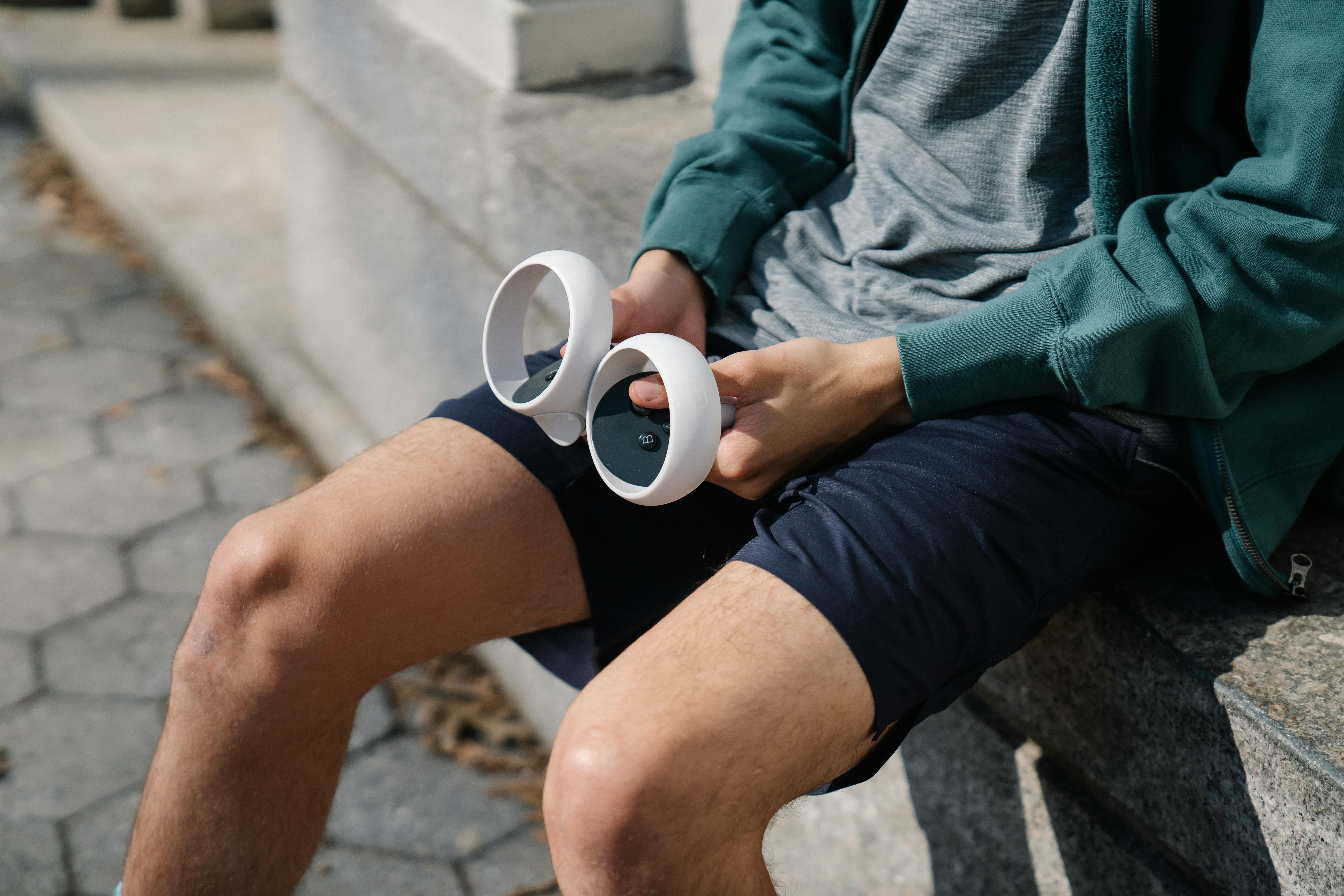 crop man in activewear using controllers