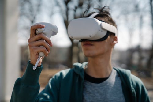 Free Man playing game with VR headset Stock Photo