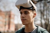 Tired ethnic man in VR headset in sunbeam