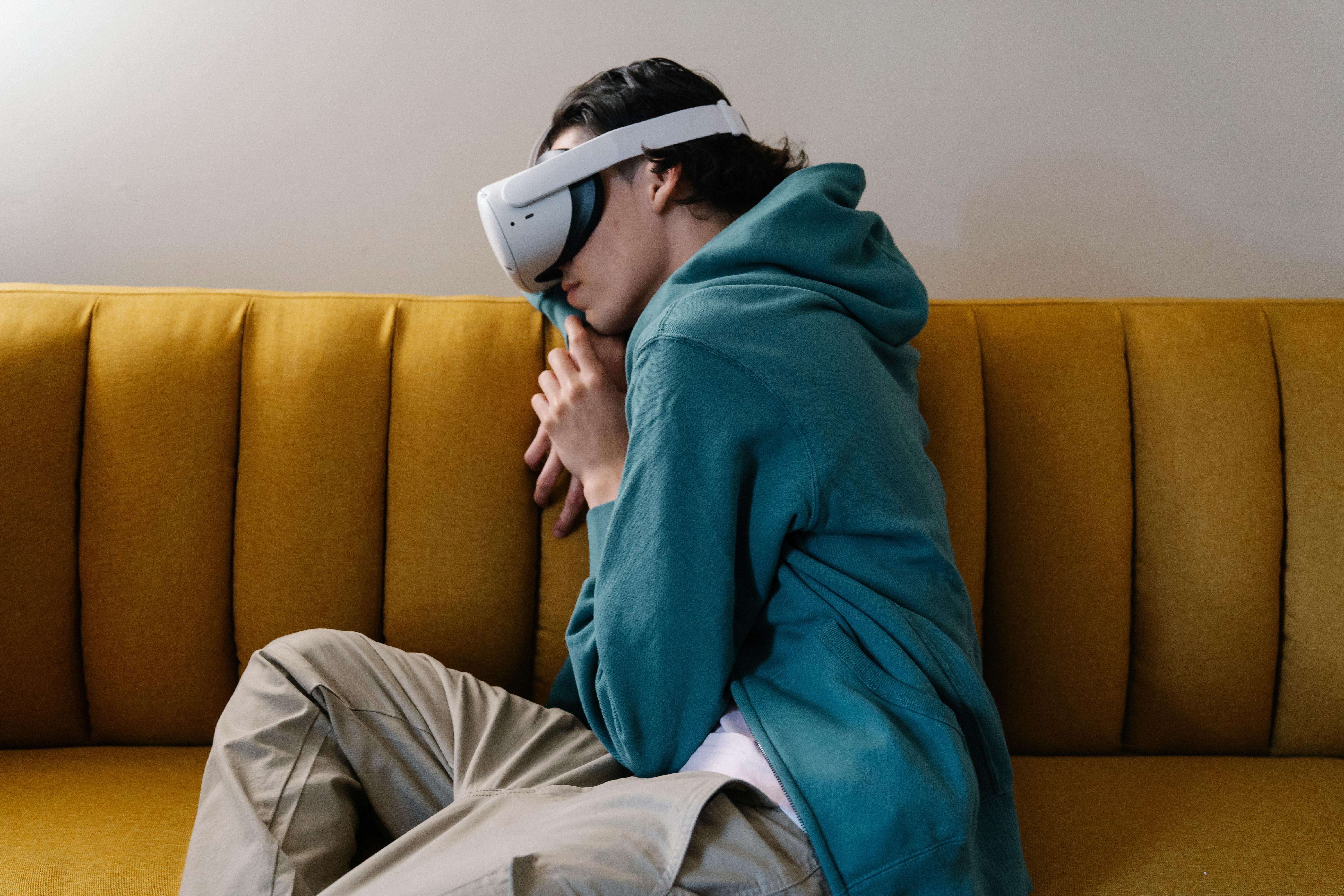 man in vr headset sleeping on sofa