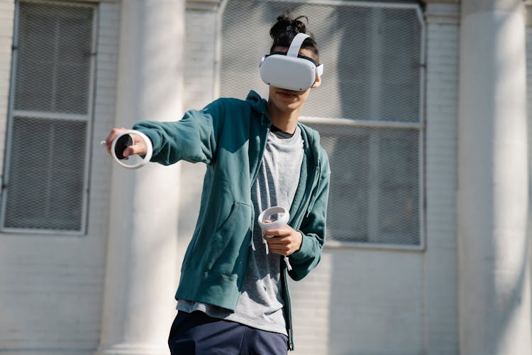 Gamer In VR Headset Playing Video Game On Street