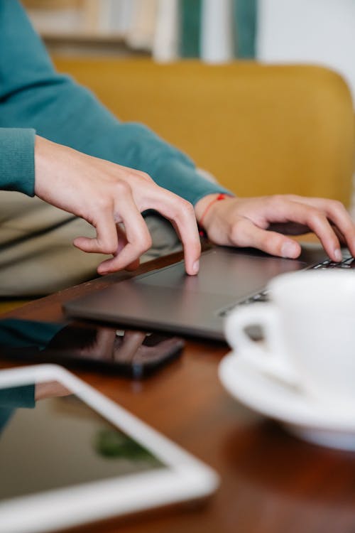 Free Person Using a Laptop Stock Photo