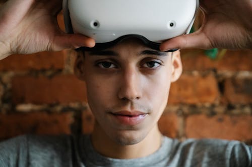 Free Man Holding a VR Headset Stock Photo
