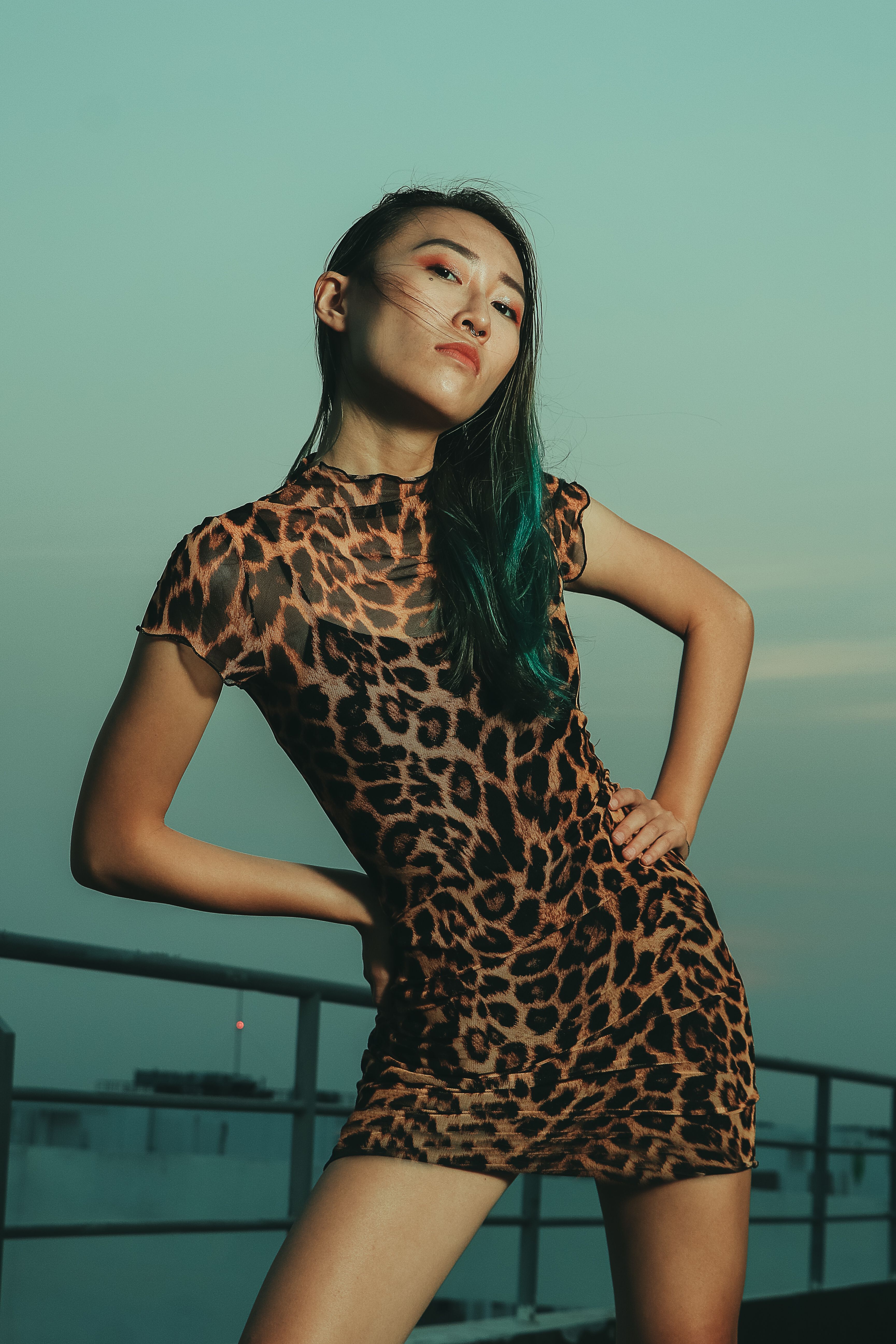 Woman in leopard print dress