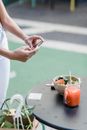 Faceless blogger taking photo of vegetarian food on smartphone