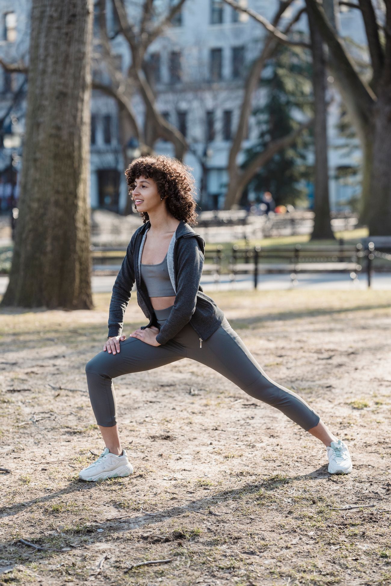Woman stretching outdoors representing the energy option
