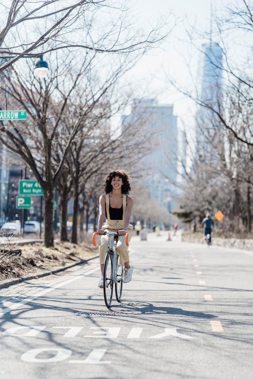 A Woman Riding a Road Bike