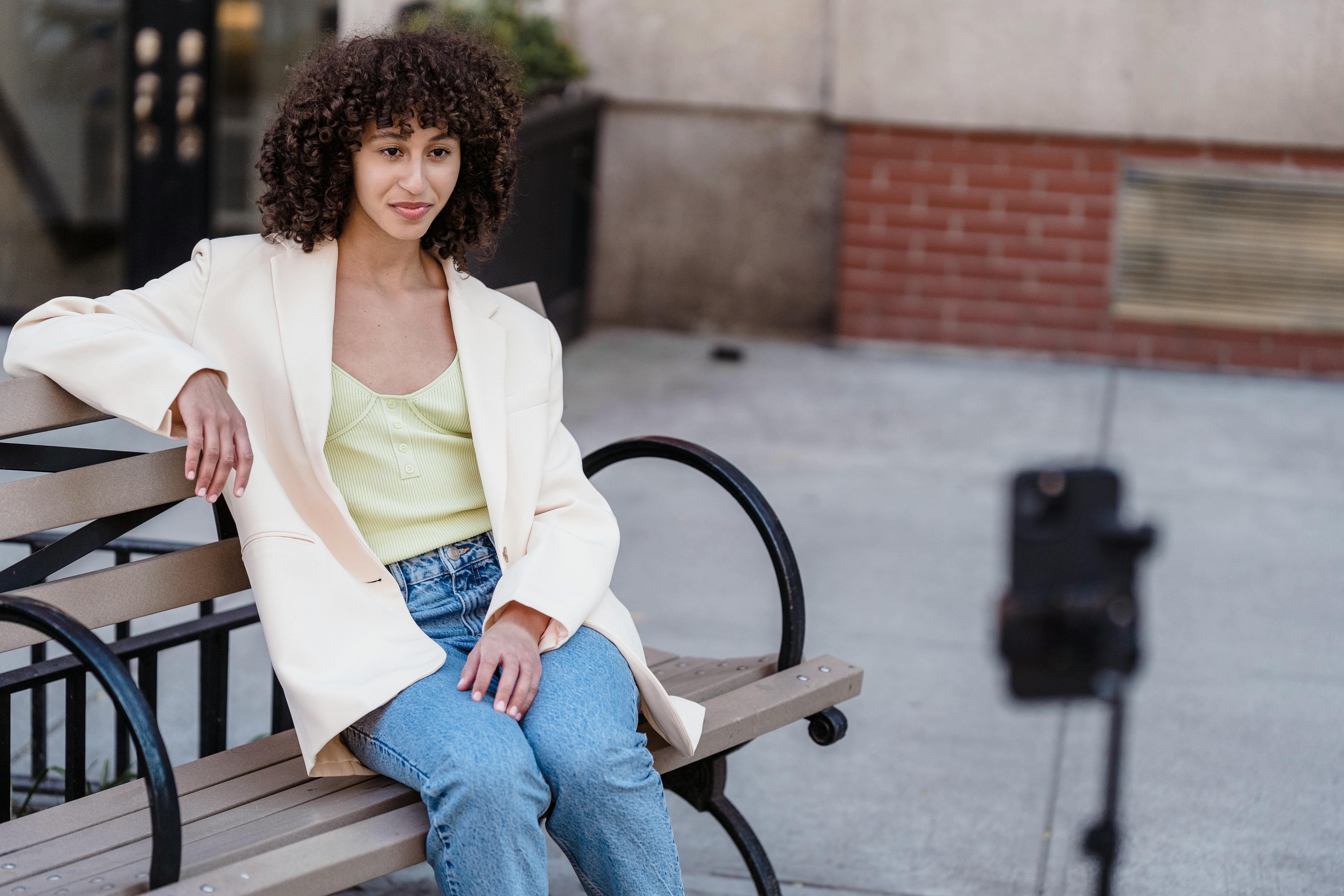 fashionable ethnic woman having video conversation on smartphone