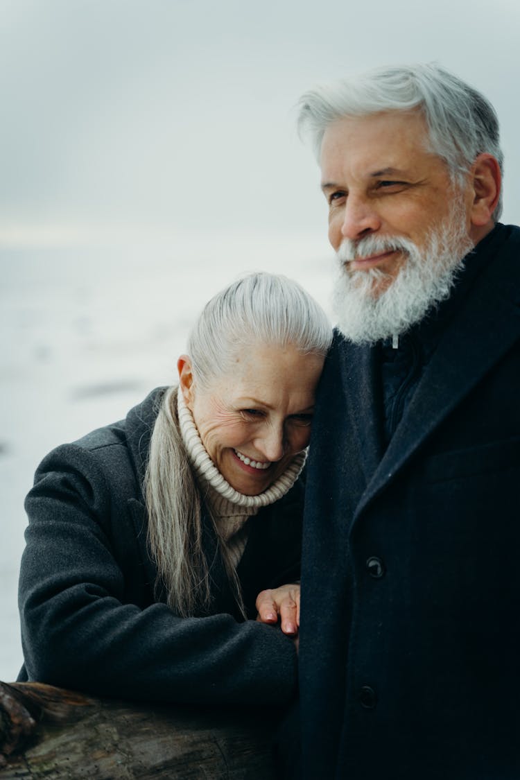 Elderly Woman Leaning On A Man